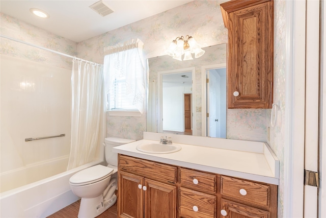 full bathroom with vanity, shower / bath combination with curtain, and toilet