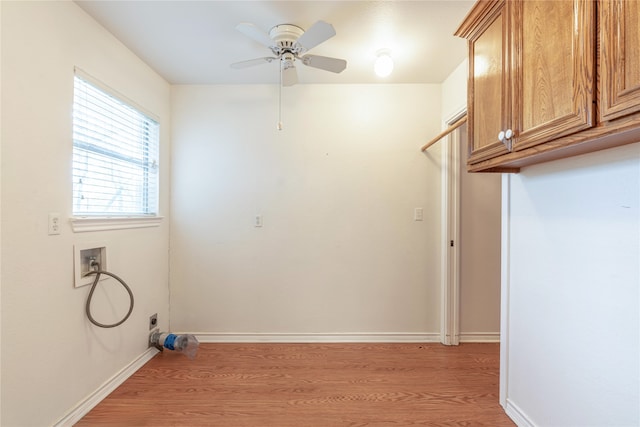 laundry room with ceiling fan, cabinets, washer hookup, and light wood-type flooring