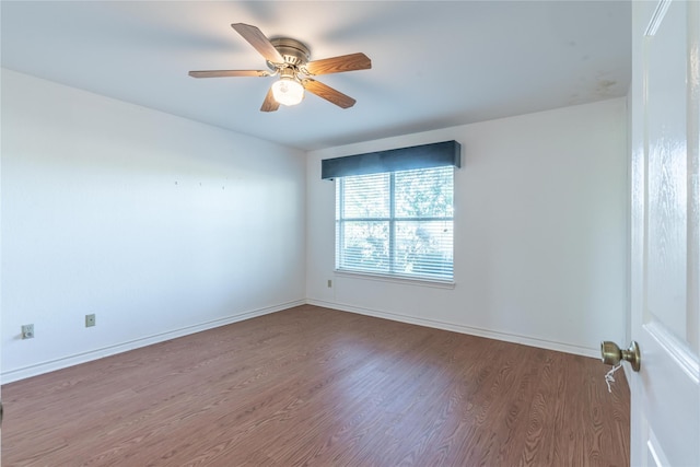 spare room featuring ceiling fan and wood-type flooring