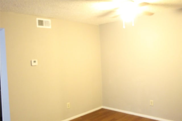 unfurnished room featuring wood-type flooring