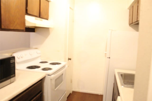 kitchen with electric range and sink