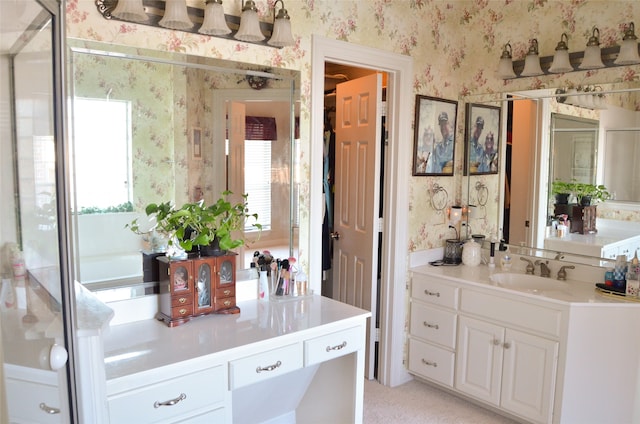 bathroom with vanity and a healthy amount of sunlight