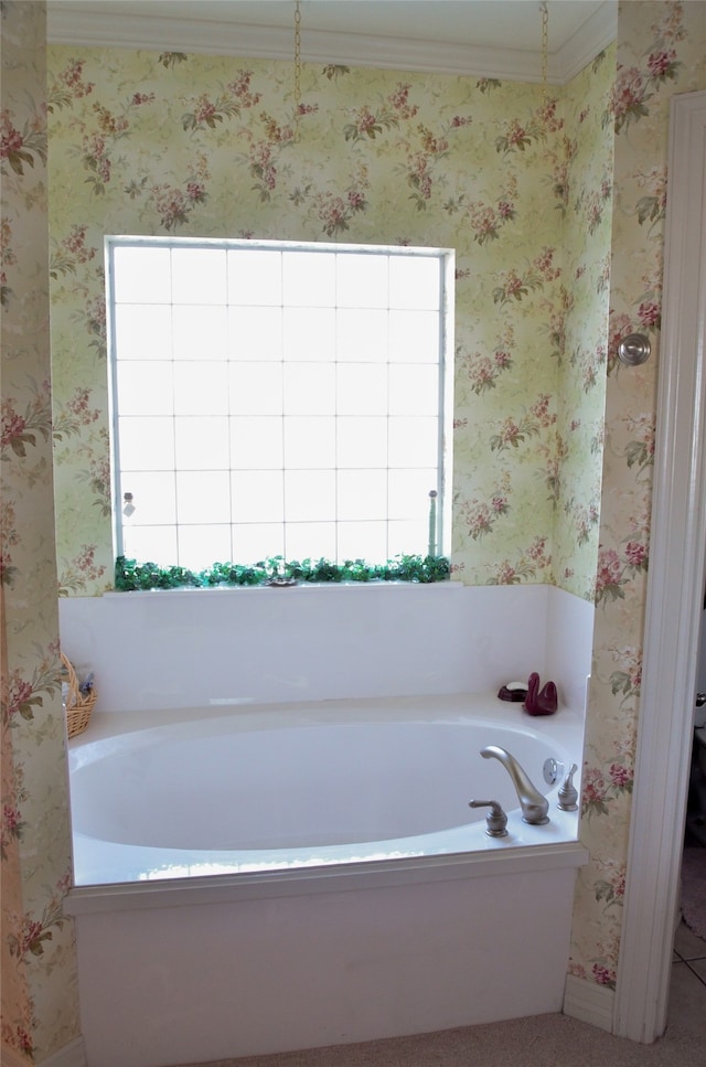 bathroom featuring a washtub and ornamental molding