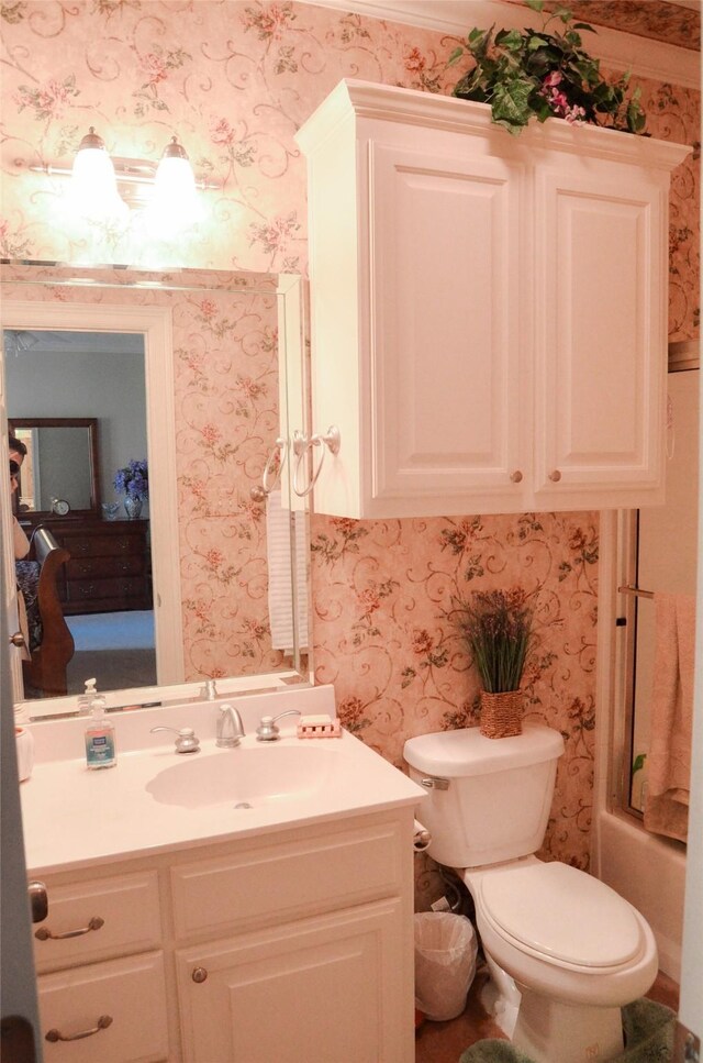 full bathroom with shower / bath combination with glass door, vanity, and toilet