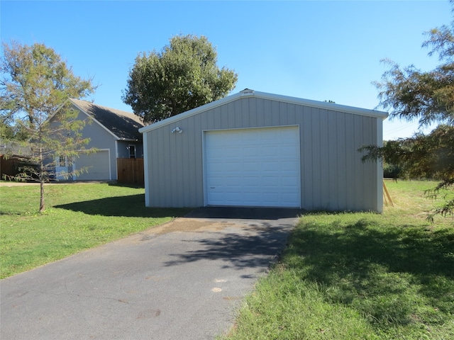 garage featuring a yard