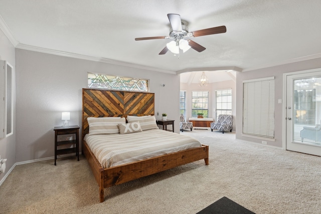 carpeted bedroom featuring ceiling fan with notable chandelier, access to exterior, vaulted ceiling, and ornamental molding