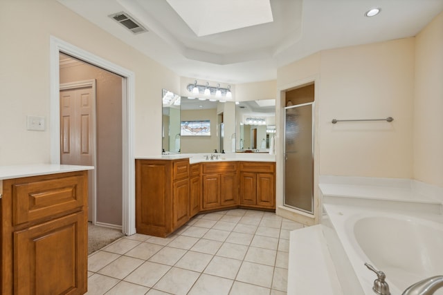 bathroom featuring vanity, tile patterned floors, and plus walk in shower