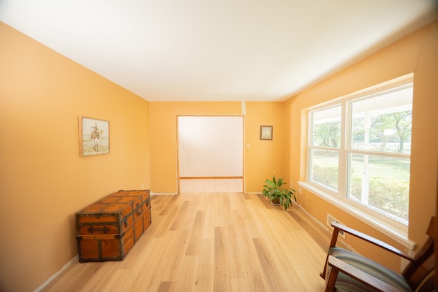 corridor with light wood-type flooring