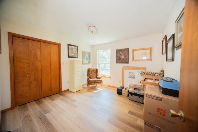 sitting room featuring light hardwood / wood-style floors