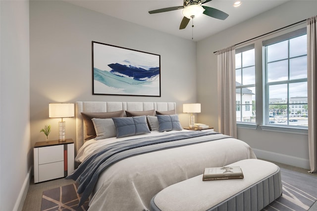 carpeted bedroom featuring ceiling fan