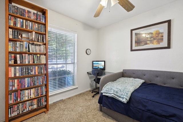 carpeted bedroom featuring ceiling fan