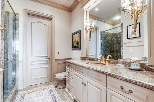 bathroom with walk in shower, vanity, toilet, and crown molding