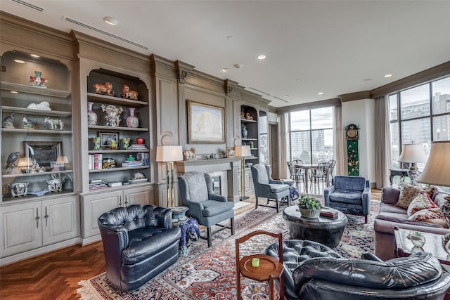 living room with built in features and dark parquet flooring