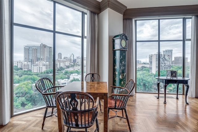 dining room featuring a wealth of natural light and light parquet floors