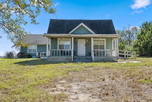 bungalow-style house with a porch and a front yard