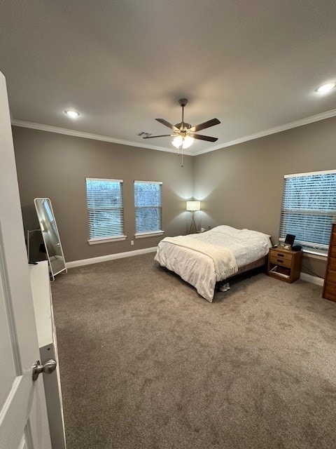 bedroom featuring ceiling fan, carpet floors, and ornamental molding