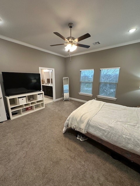 bedroom featuring carpet flooring, ensuite bathroom, ceiling fan, and crown molding