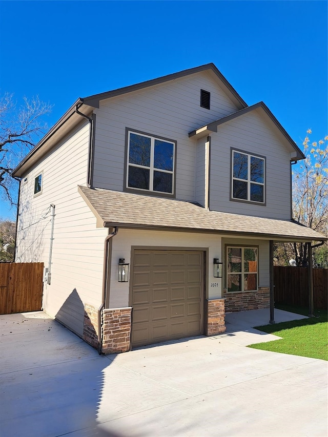 view of front of property featuring a garage