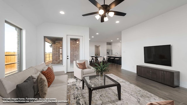 living room with recessed lighting, ceiling fan, baseboards, and wood finished floors