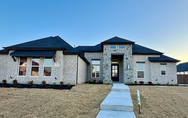 view of front of home with a yard