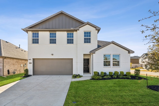 view of front facade featuring a garage and a front lawn