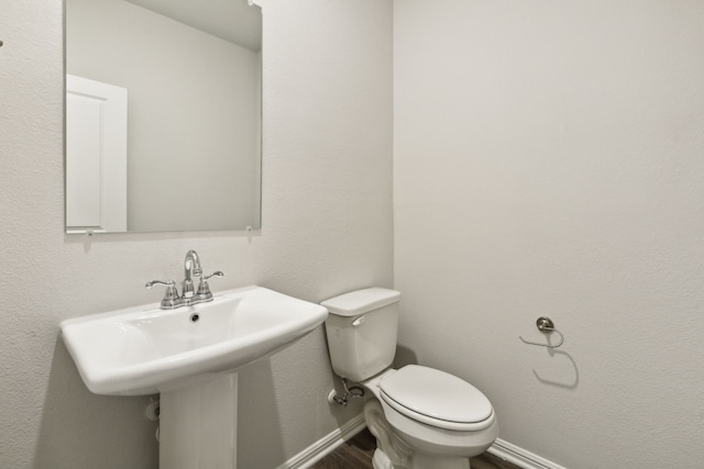 bathroom with toilet and sink