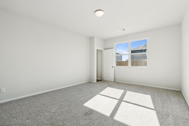 spare room featuring carpet floors