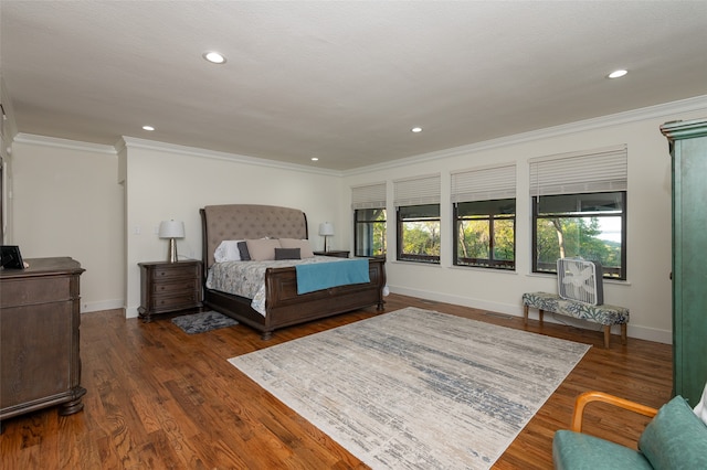 bedroom with ornamental molding, multiple windows, and dark hardwood / wood-style floors