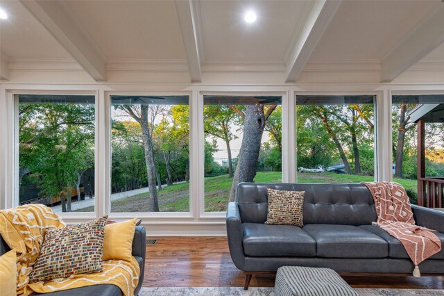 sunroom / solarium with a wealth of natural light and beam ceiling