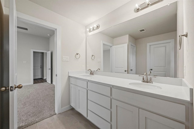 bathroom with tile patterned flooring and vanity