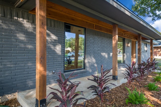 view of property exterior featuring a porch