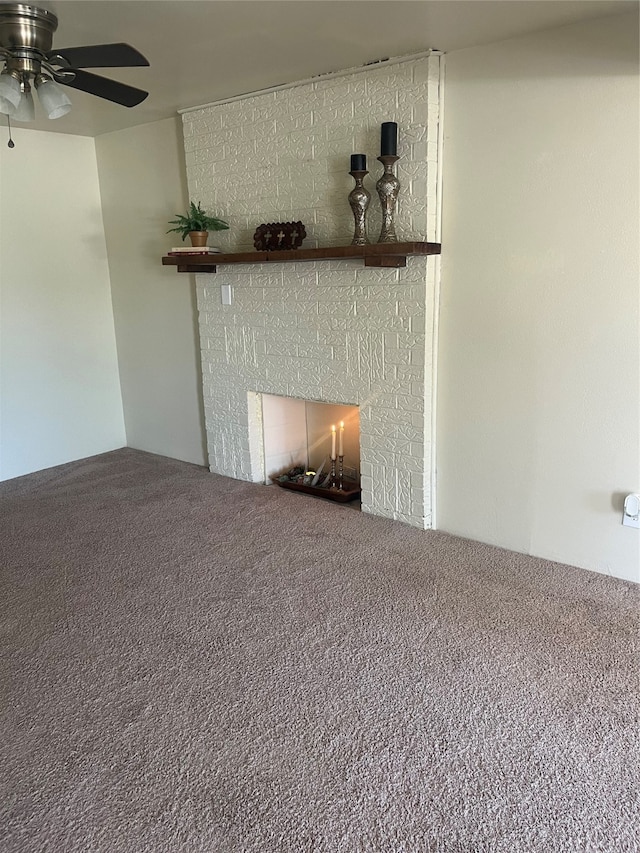 details featuring carpet, a large fireplace, and ceiling fan