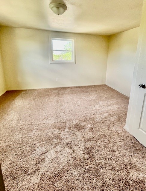 empty room featuring carpet flooring