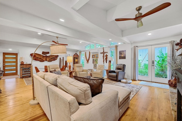 living room featuring lofted ceiling with beams, ceiling fan, recessed lighting, french doors, and light wood finished floors