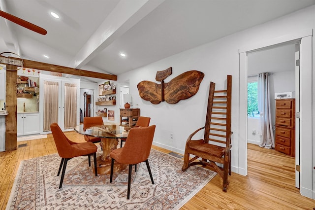 dining room featuring vaulted ceiling with beams, light wood-style flooring, baseboards, and recessed lighting