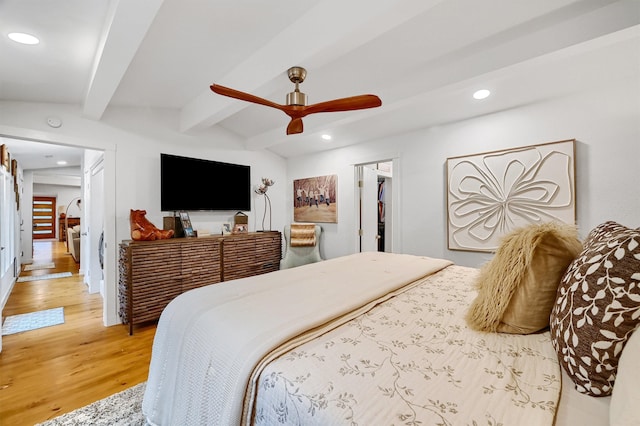 bedroom with a ceiling fan, recessed lighting, lofted ceiling with beams, and wood finished floors