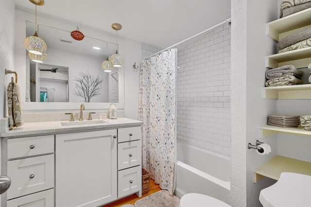 full bathroom featuring toilet, shower / bath combo, vanity, and wood-type flooring