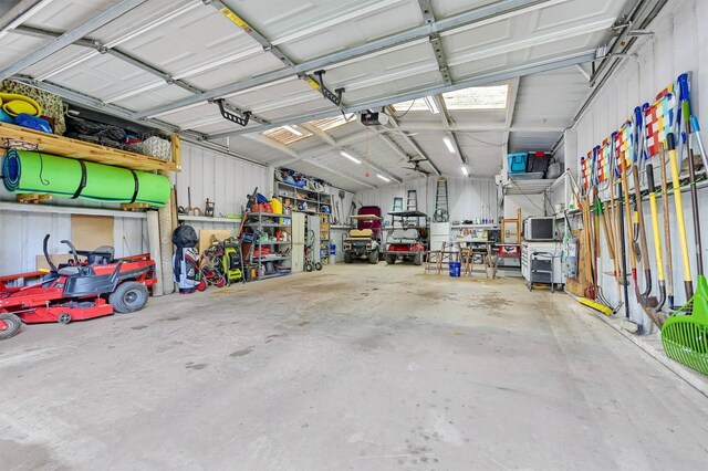 garage featuring metal wall and a garage door opener