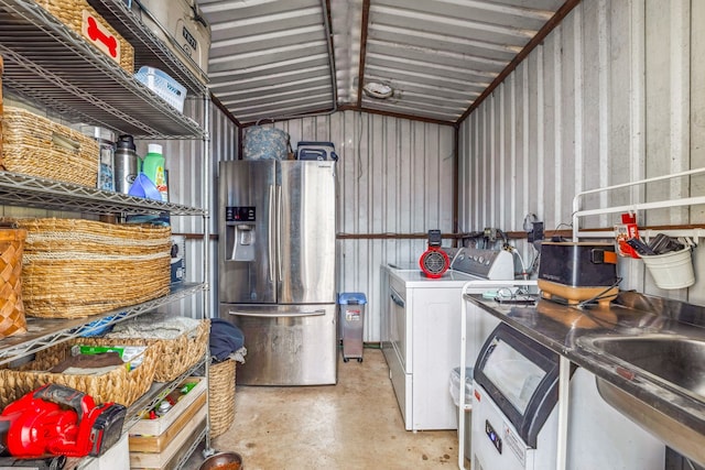 clothes washing area with washer and clothes dryer