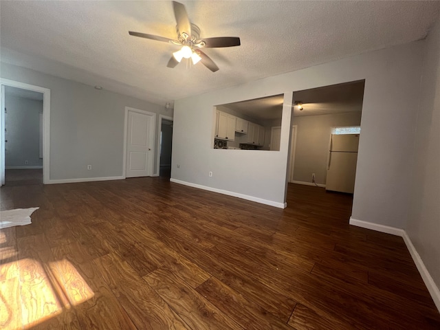 unfurnished living room featuring dark hardwood / wood-style flooring, a textured ceiling, and ceiling fan