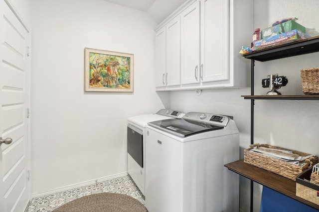 laundry room with cabinets and washing machine and dryer