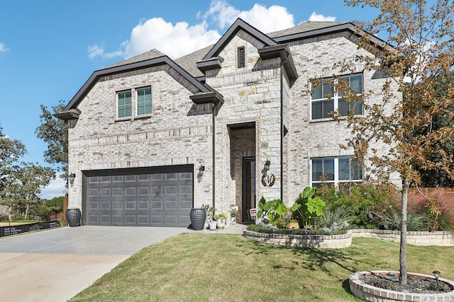 view of front of house with a garage and a front lawn