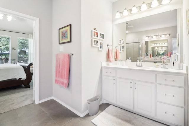 bathroom with vanity and tile patterned flooring