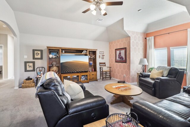 living room featuring light colored carpet, lofted ceiling, and ceiling fan