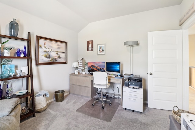 carpeted office space featuring lofted ceiling