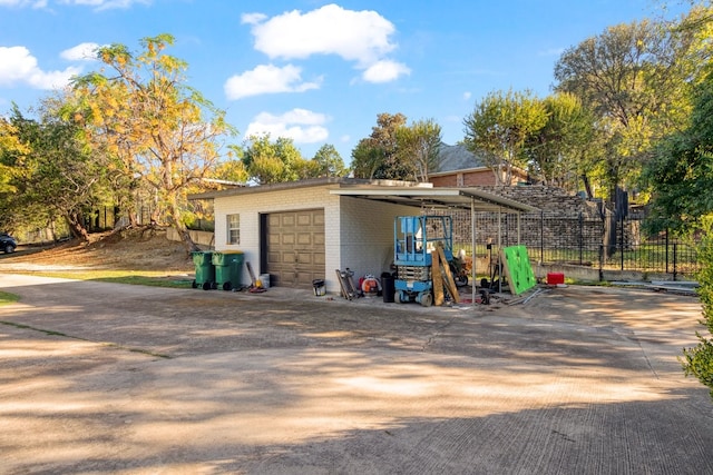 garage featuring a carport