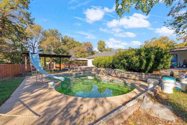 view of pool with a water slide