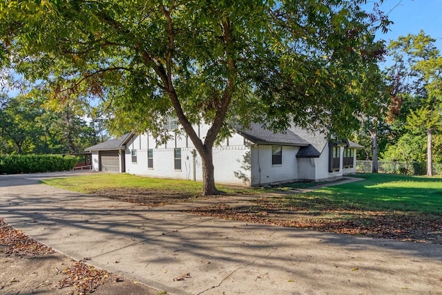 view of side of home with a garage