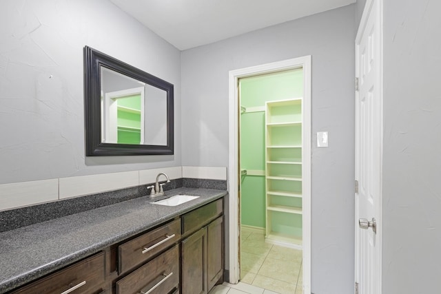 bathroom featuring tile patterned floors and vanity