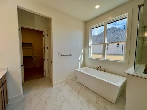 bathroom featuring vanity and separate shower and tub